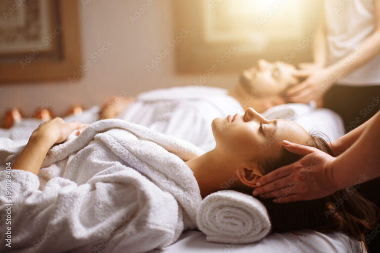young-couple-receiving-head-massage-at-beauty-spa-stockpack-adobe-stock